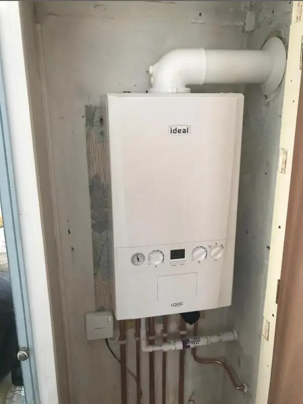 Ideal Logic combi boiler installation in cupboard with copper pipework in Barry