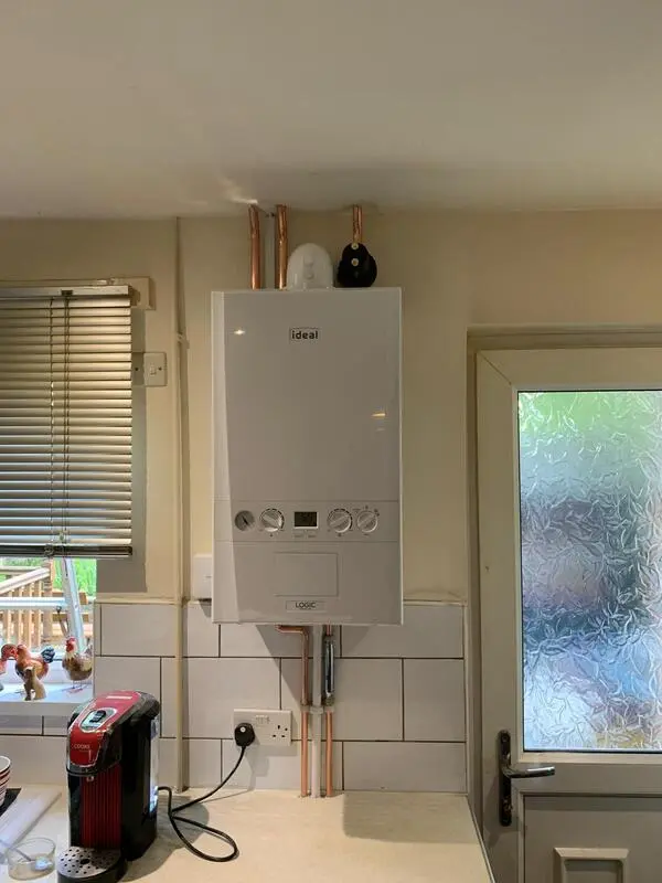 Ideal Logic boiler installed in kitchen with neat copper pipe runs