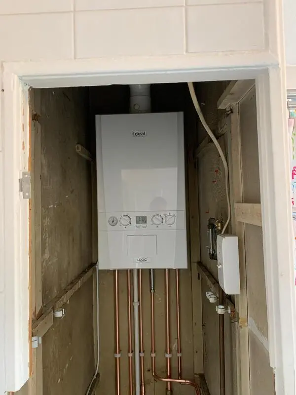 Ideal Logic boiler installation in kitchen cupboard recess