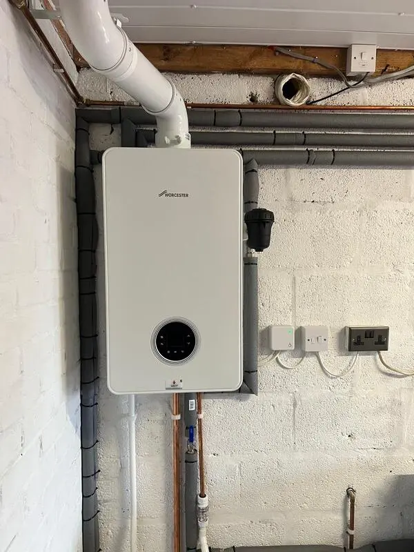 Worcester Bosch boiler installed in garage with smart controls and filter