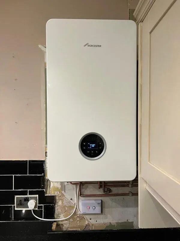 Worcester Bosch Greenstar boiler installed in kitchen with copper pipework