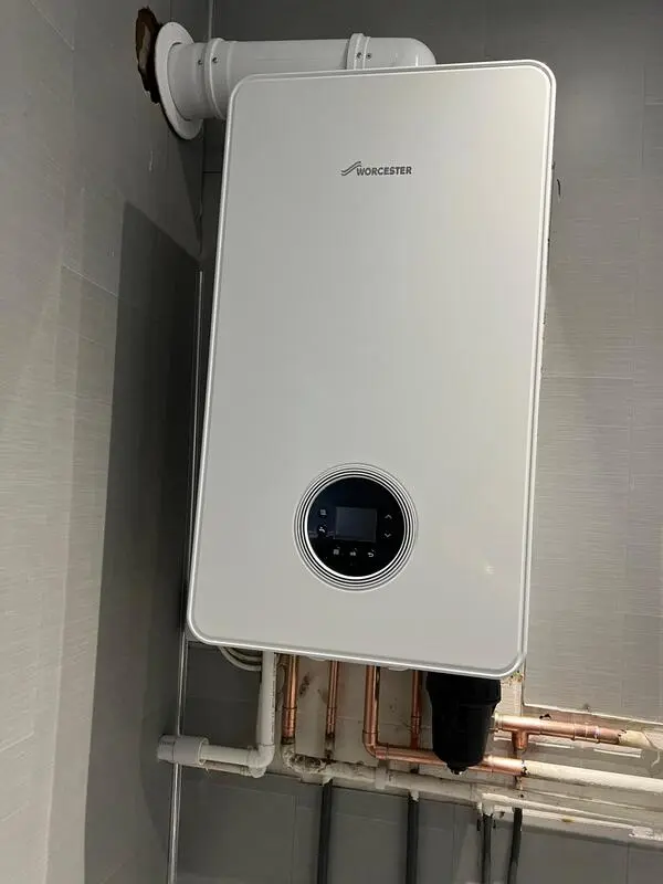 Worcester Bosch boiler installation in bathroom with tiled surround