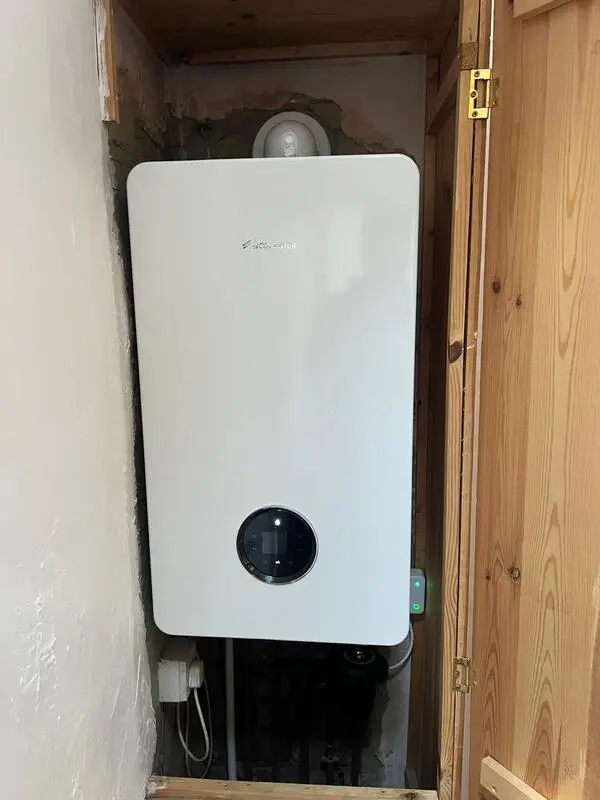 Worcester Bosch Greenstar boiler installed in pine cupboard with filter